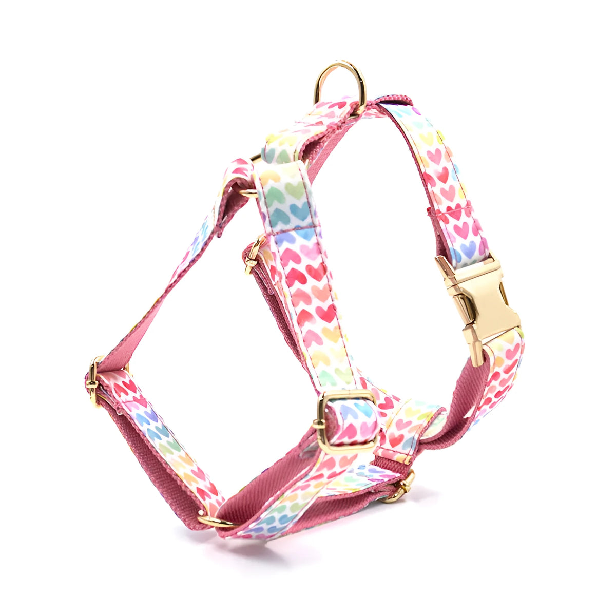 Pink colourful dog harness with heart-shaped stones and gold buckle in chest and back strap design