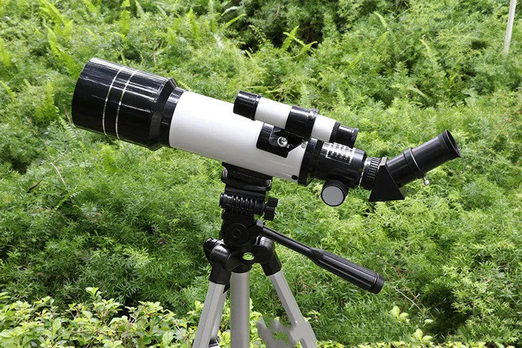 Dark blue children's astronomical telescope with monocular design and tripod for stargazing