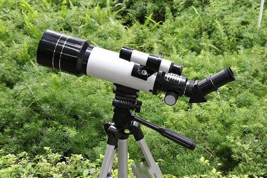 Dark blue children's astronomical telescope with monocular design and tripod for stargazing