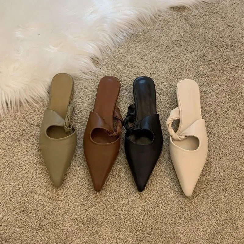 Women's soft leather slippers with semi-toe box design, available in black, khaki, cream-white and dark brown in UK sizes 35 to 39, featuring rubber sole material for indoor comfort and a spring special-interest aesthetic.
