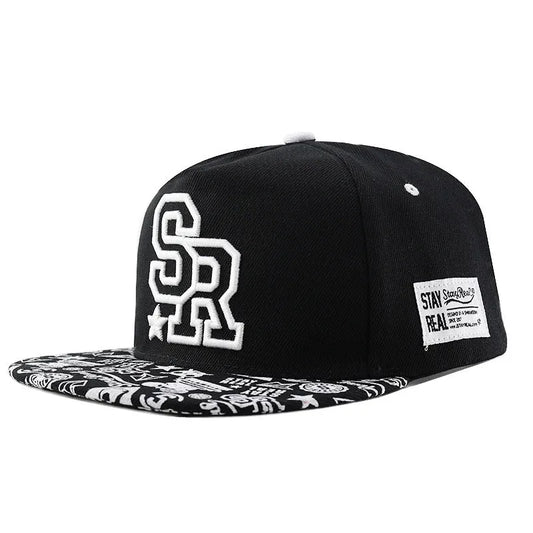 Cotton baseball hat with letter embroidery showing dome crown and adjustable strap in black and white colour options