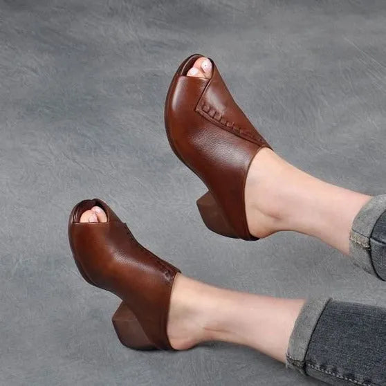 Women's black square heel peep toe slippers with a fish mouth scaffold design and rubber sole.