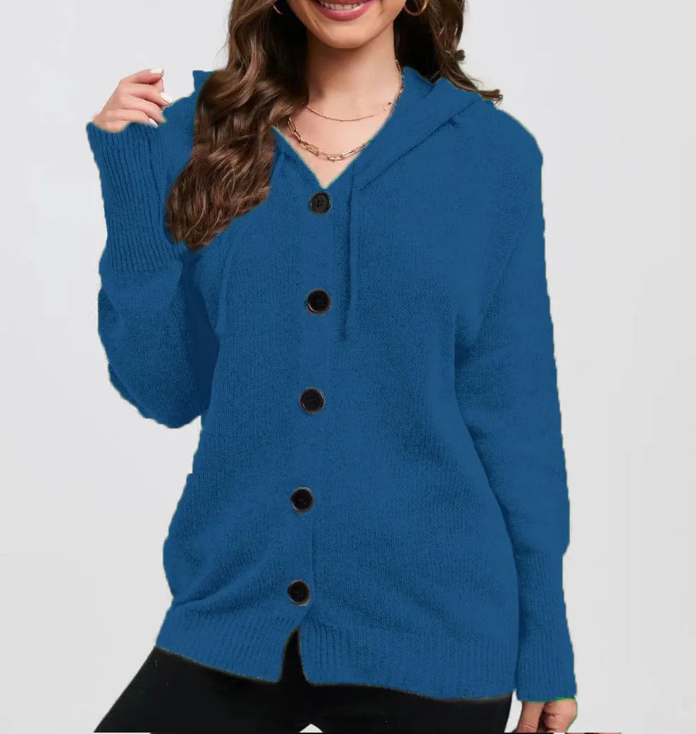 A woman wearing a loose, thick, hooded cotton cardigan in a solid colour.