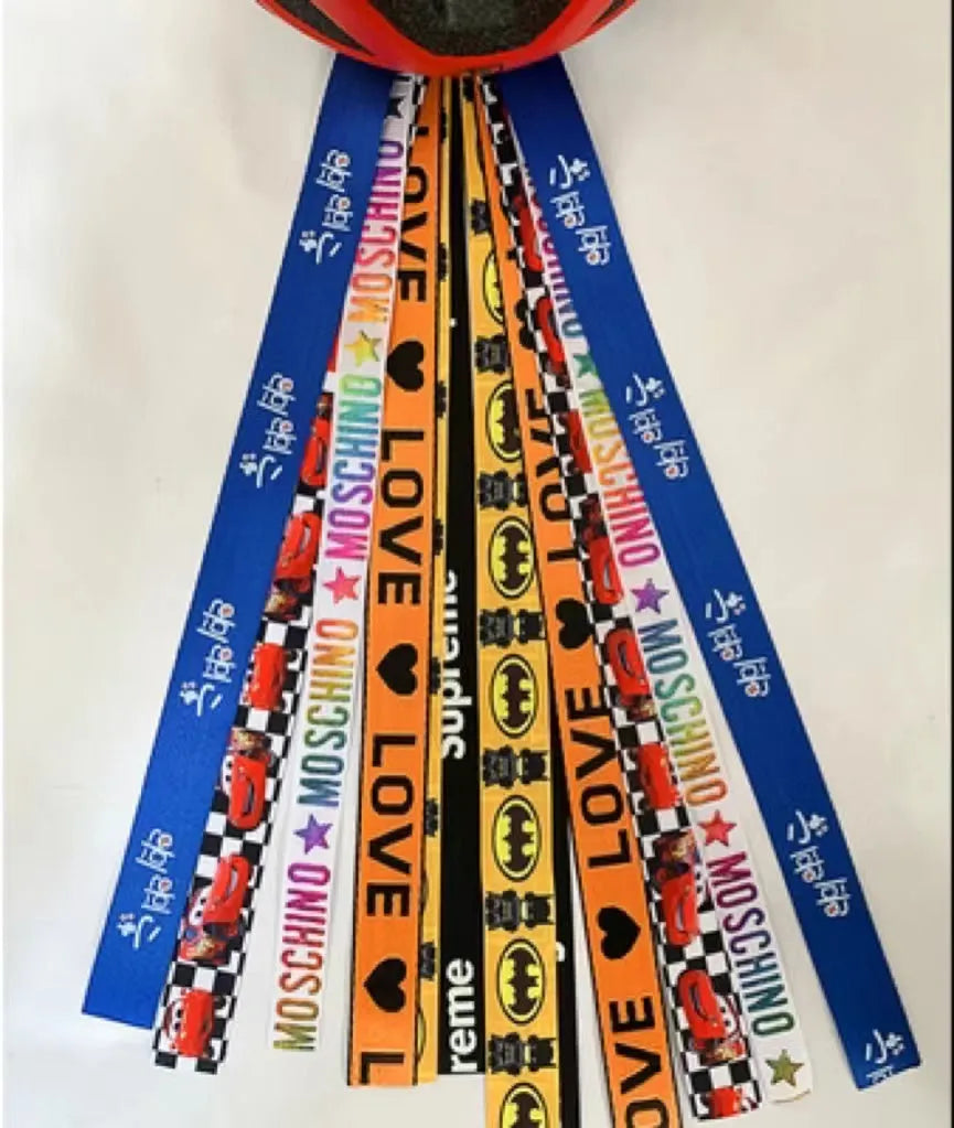 Children's helmet streamer with 60 cm polyester ribbon in colours like apricot and khaki for roller skating and skiing