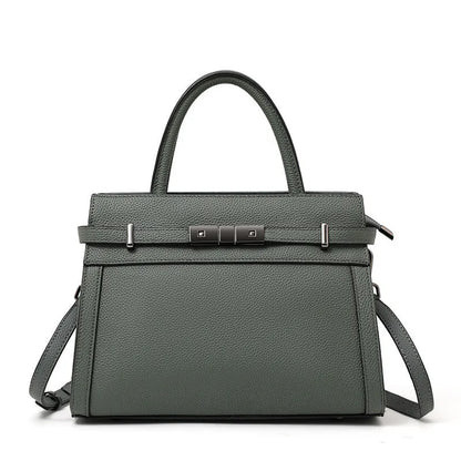 Women's square genuine leather crossbody handbag in clamshell style with internal compartments.