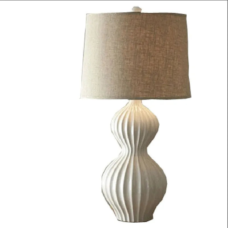 American country style ceramic table lamp with white fabric shade on wooden table
