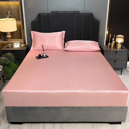 Houndstooth ice silk jacquard fitted three-piece bedding set in ice blue, 180x200cm size with pillowcases on white bed