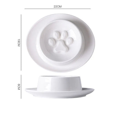 Green ceramic slow feeder bowl for pets with high walls and a non-slip rubber base.