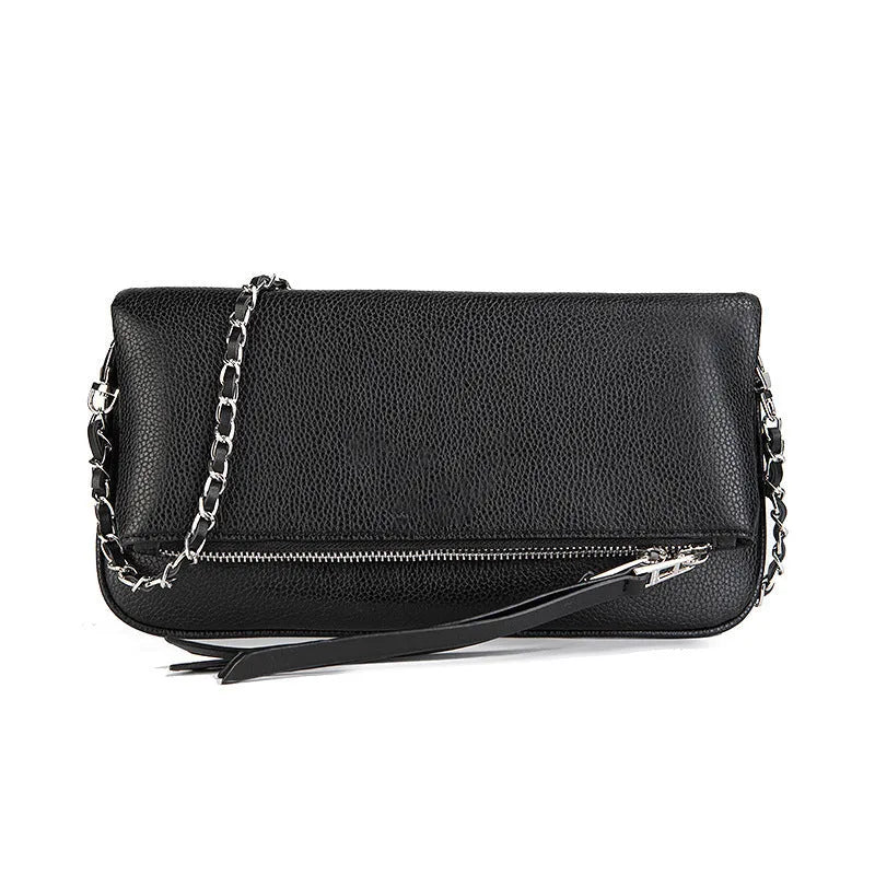 Soft black PU leather women's clutch bag with a gold chain strap, shown held and worn cross-body.