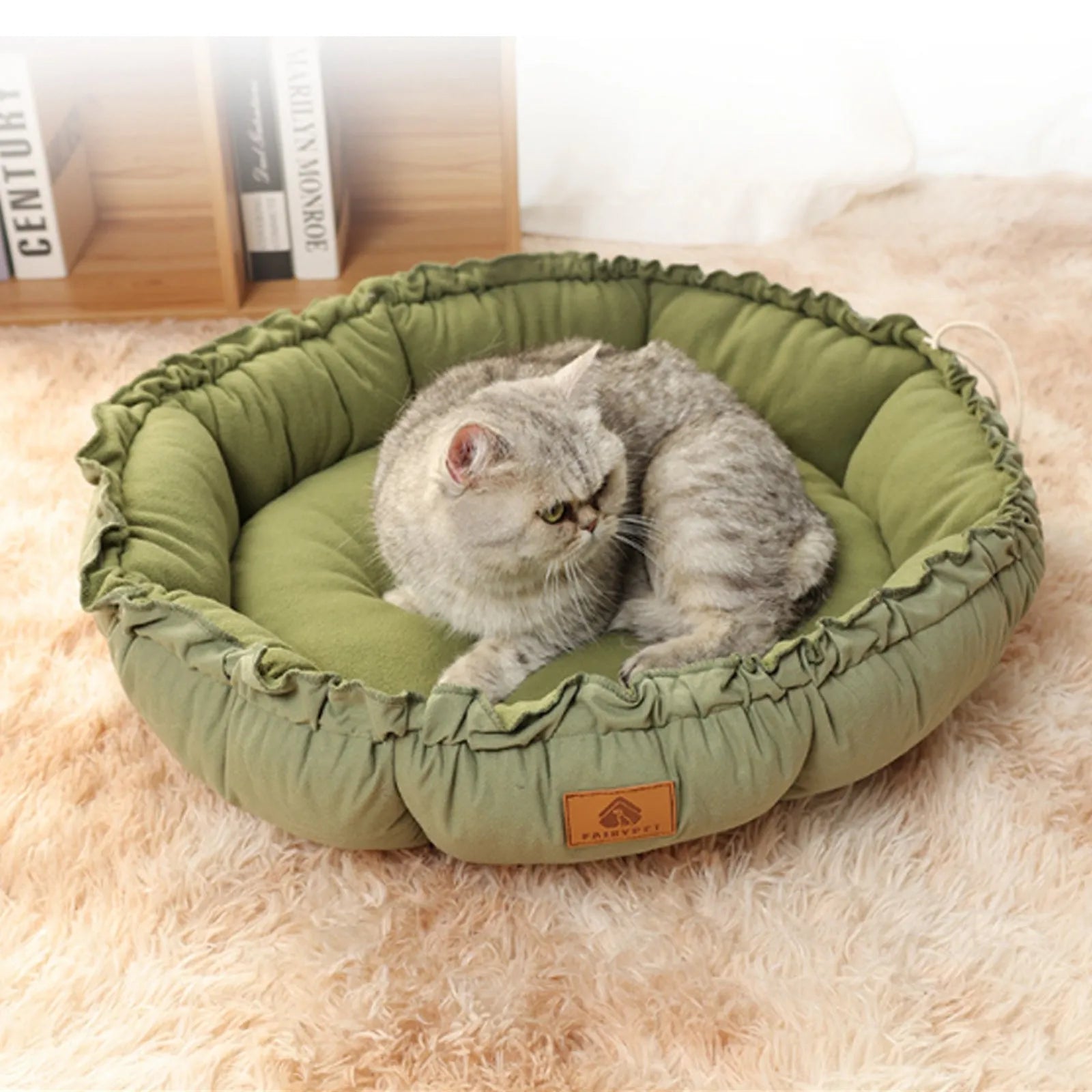 Reversible grey and green donut-shaped pet bed for cats and small dogs