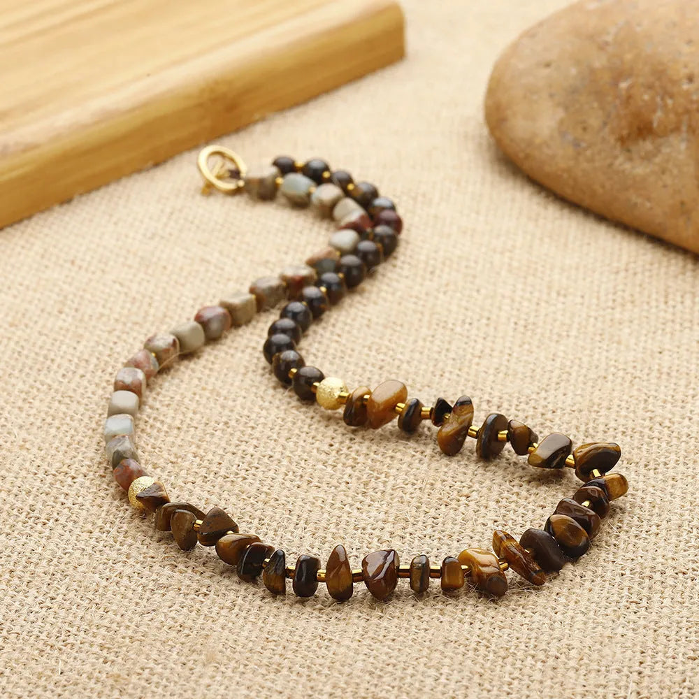 Brown geometric tigereye and bronze bracelet with textured bends and hitches detailing