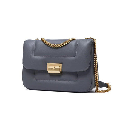 Premium grey split leather crossbody bag with adjustable metal chain strap, showcasing a compact and stylish design