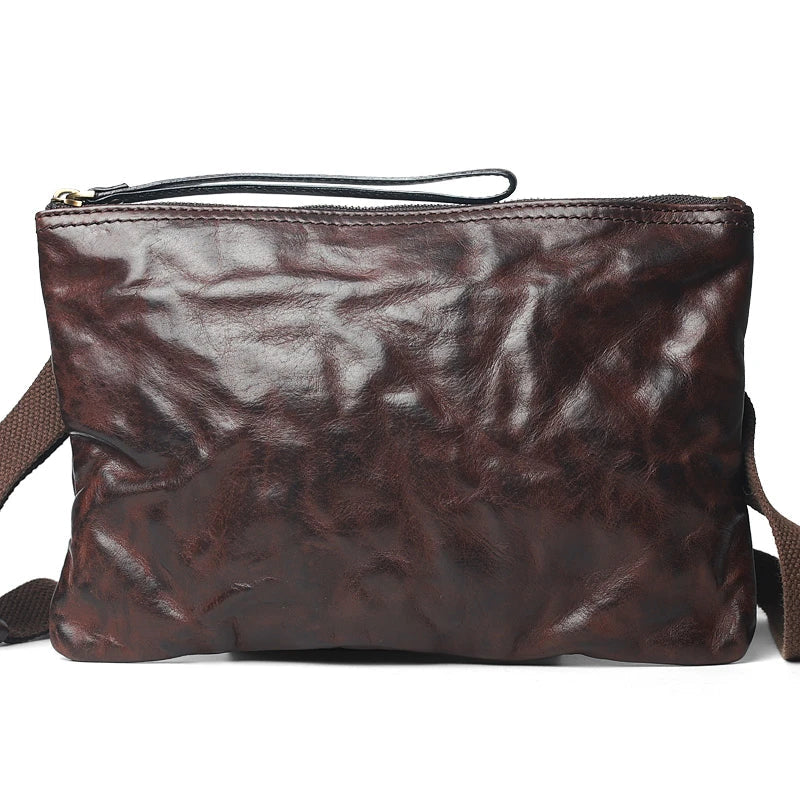Handmade vintage-inspired leather crossbody bag with ruffled design and zipper closure