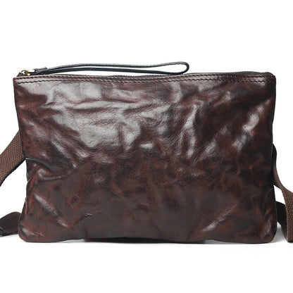 Handmade vintage-inspired leather crossbody bag with ruffled design and zipper closure