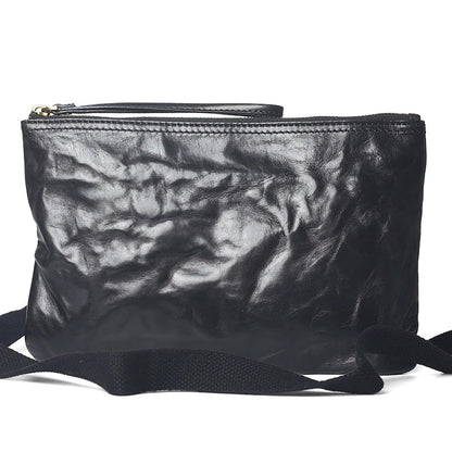 Handmade vintage-inspired leather crossbody bag with ruffled design and zipper closure