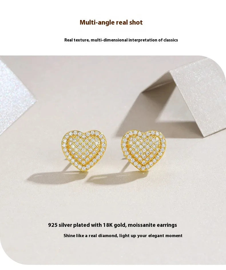Golden S925 silver stud earrings with a heart-shaped moissanite stone.