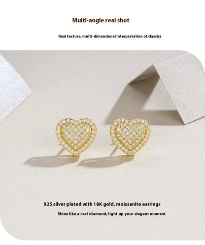 Golden S925 silver stud earrings with a heart-shaped moissanite stone.