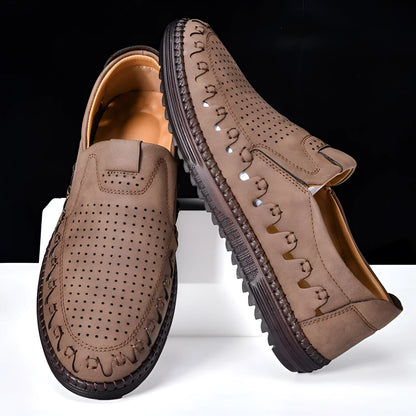 Men's brown slip-on casual shoes with round toe and flat sole shown on a white background
