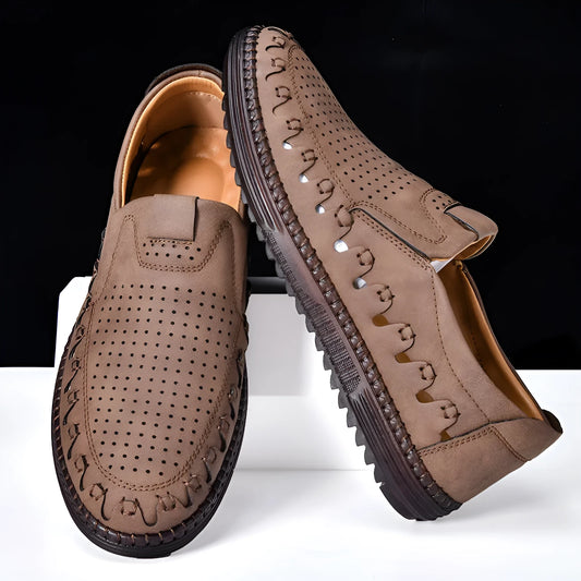 Men's brown slip-on casual shoes with round toe and flat sole shown on a white background