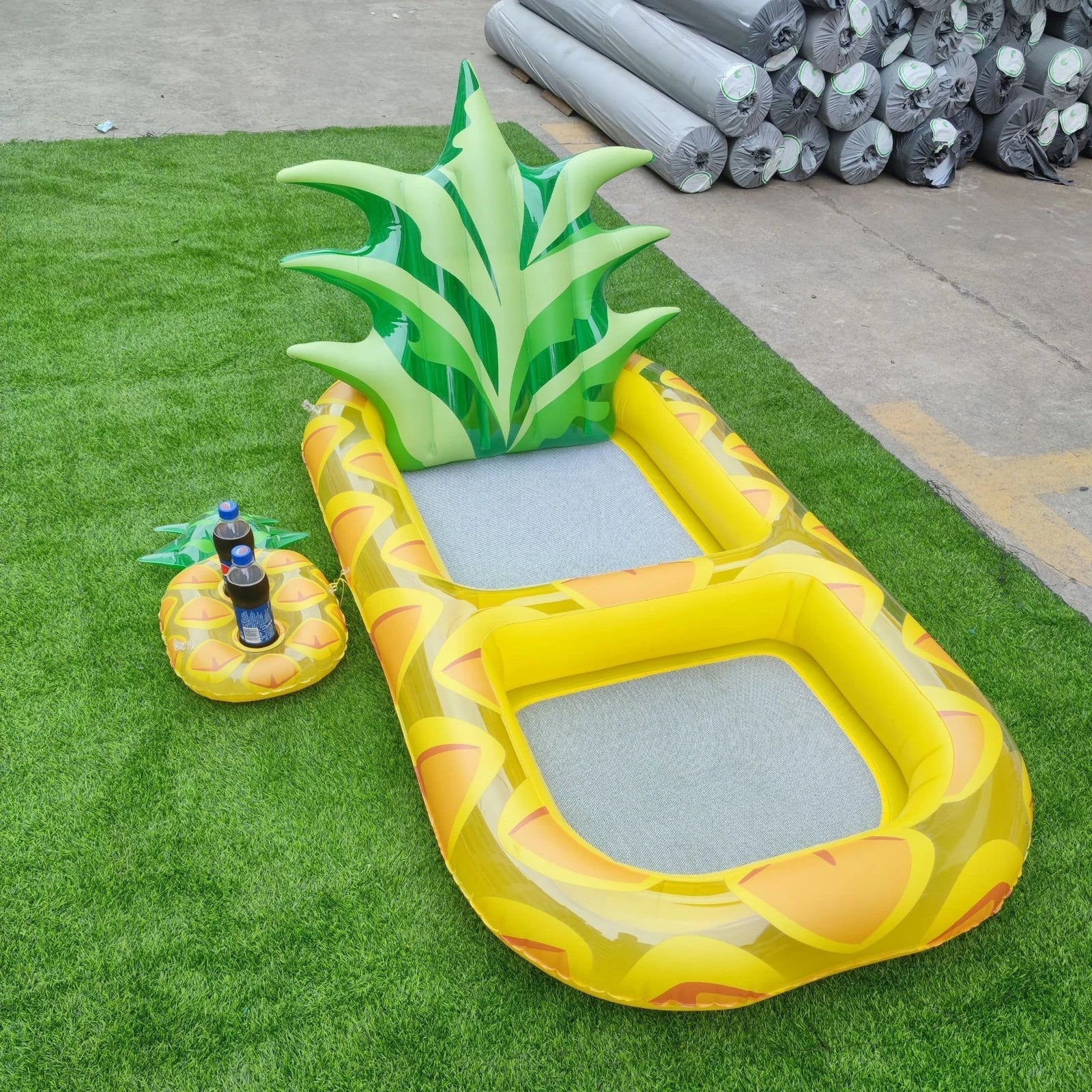 Yellow pineapple-shaped inflatable pool float with drink holder and ergonomic headrest design