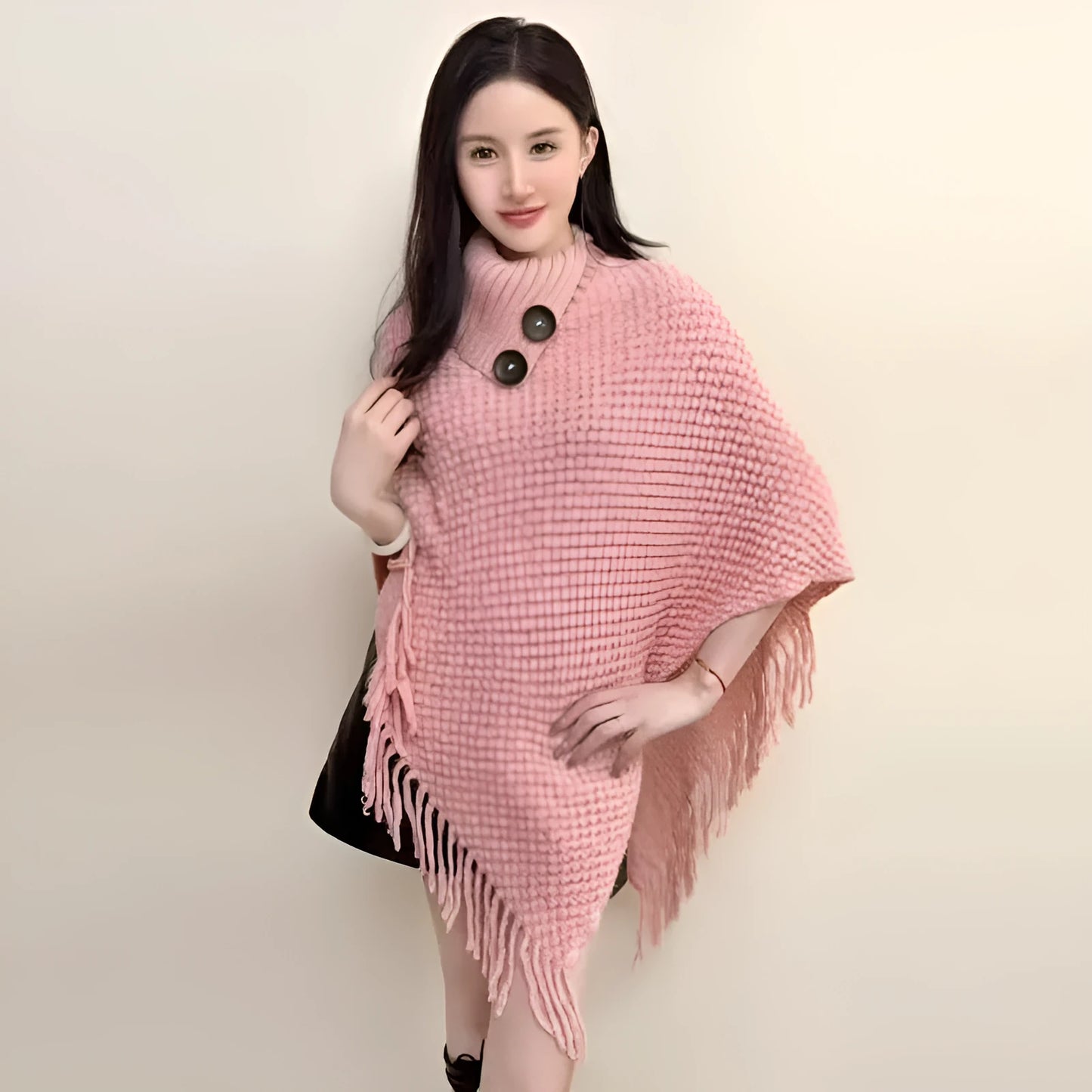 Women's triangle shawl cape in cashmere blend fabric with tassel details, shown draped over shoulders