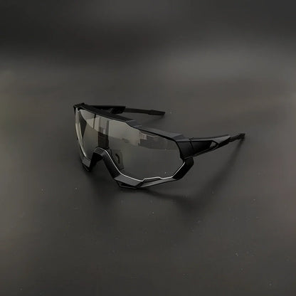 Cycling glasses with interchangeable lenses showing UV400 protection and lightweight frame design