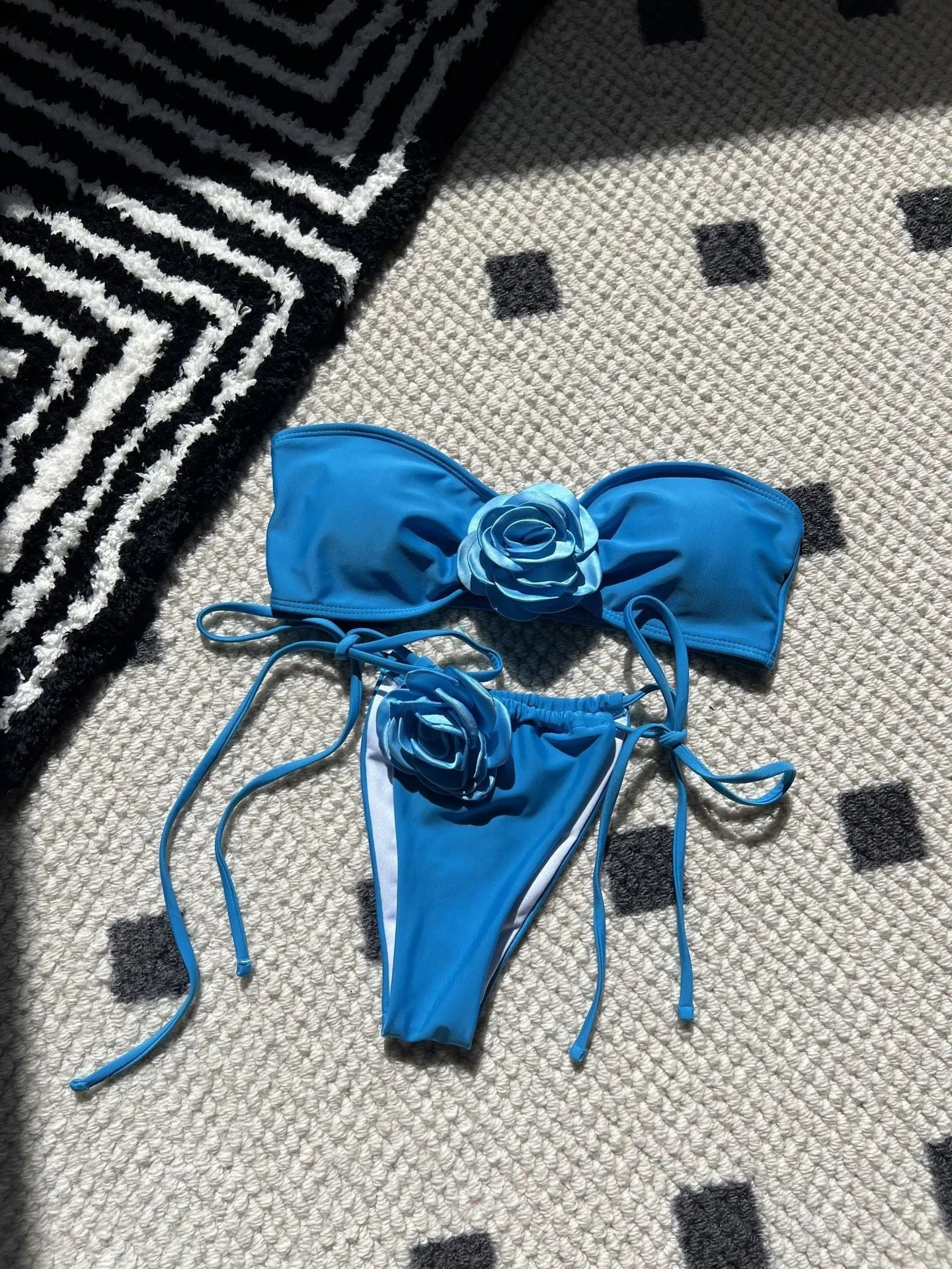 Women's adjustable drawstring tube top swimsuit with high-cut briefs in a solid colour.