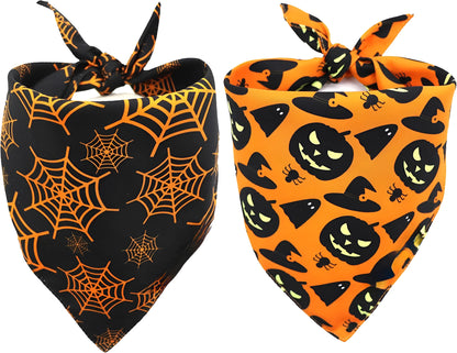 Black and orange reversible Halloween dog bandana with pumpkin and spider web print laid flat