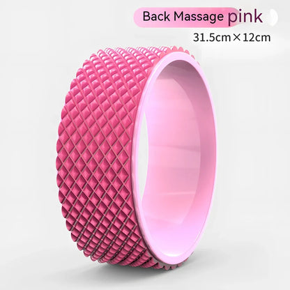 Pink yoga wheel with 31.5cm diameter and 12.2cm width for back-bending exercises