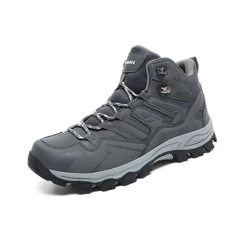 Low-top hiking sneaker in multiple colours on a rocky mountain path, showing lace-up front and rubber sole.