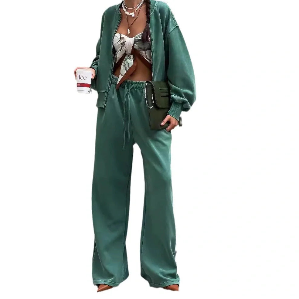 Green women's thermal sweater with front zipper and stand collar, paired with matching trousers