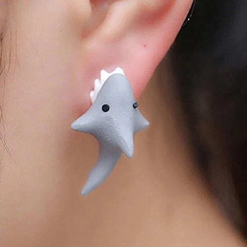 Funny animal bite earrings featuring dinosaur and whale designs in various colors