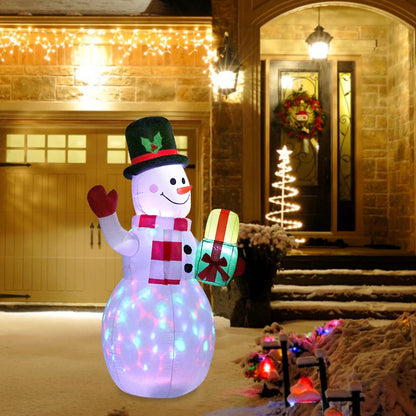 Glow-in-the-dark Christmas inflatable decorations featuring a Santa, snowman, and Christmas tree