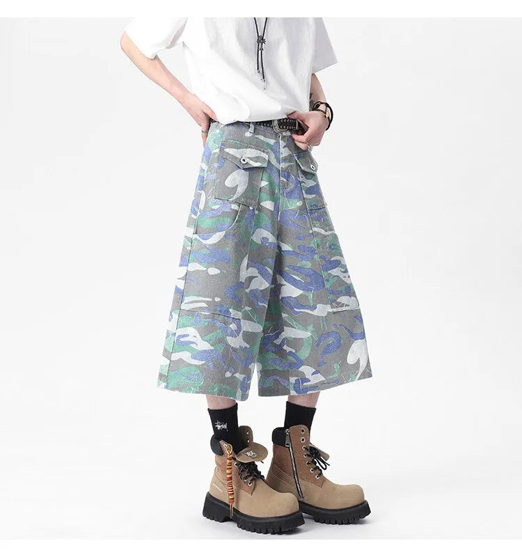 Denim workwear trousers with camouflage colour pattern, straight-leg cut, and zipper fly