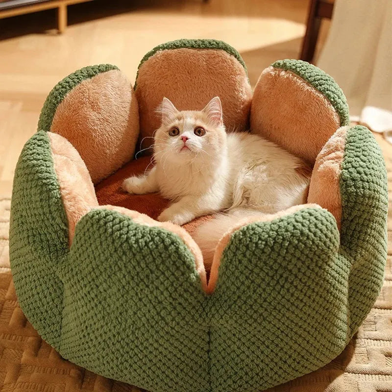 Green cactus petal shape pet bed for cats and dogs on a hardwood floor.