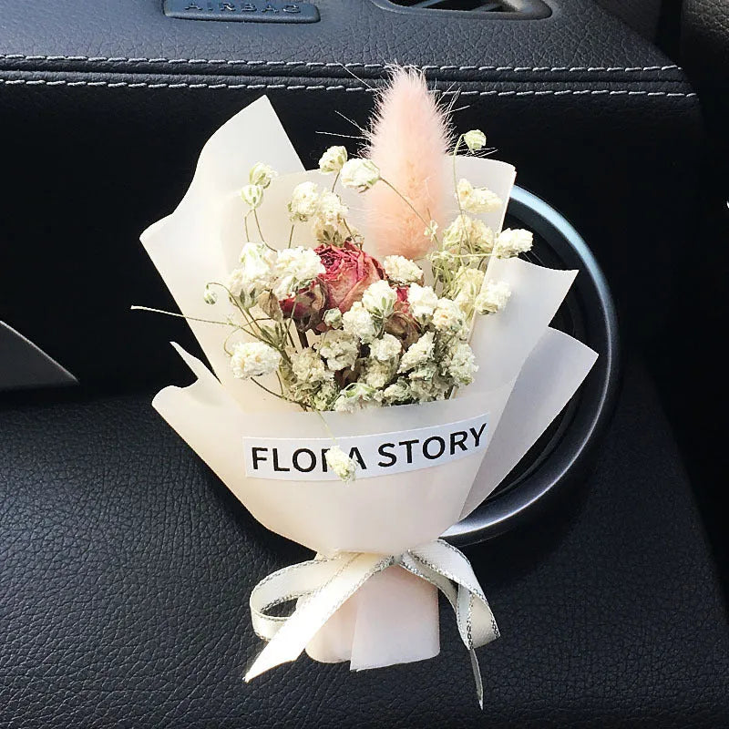 Mini dried flower bouquet mounted in car air vent for decorative aromatherapy