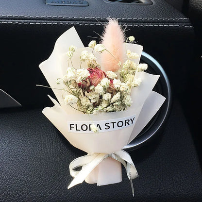 Mini dried flower bouquet mounted in car air vent for decorative aromatherapy