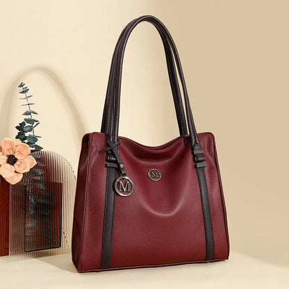 A soft PU leather women's crossbody bag in a retro style with double shoulder straps, shown in a choice of colours.
