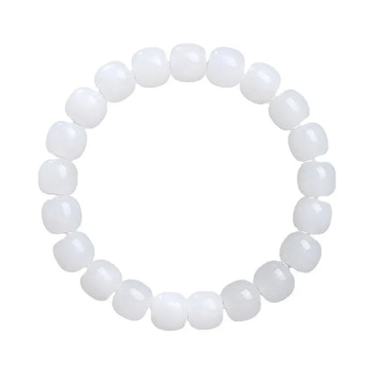 White jade barrel beads bracelet on wrist, showing Hetian jade stones in casual unisex design