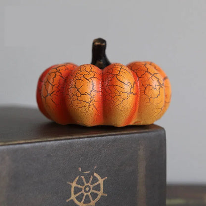 Set of three resin Halloween pumpkin lanterns with LED lights in long, medium, and short sizes.