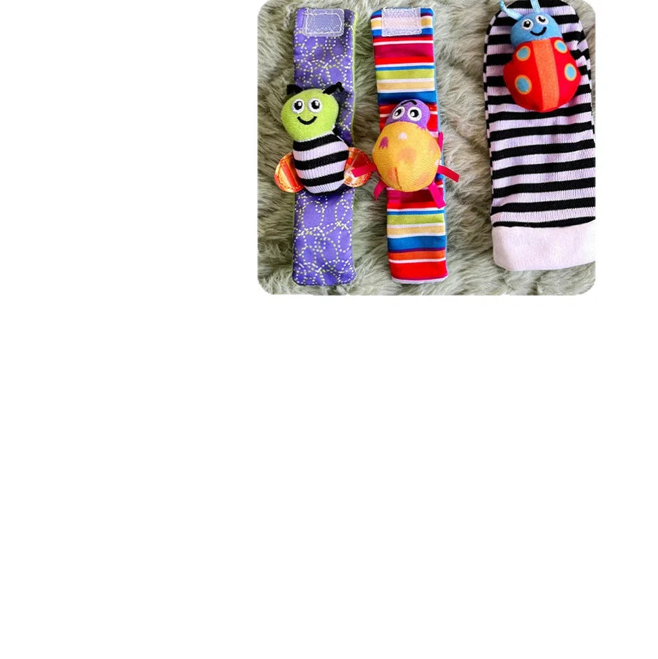 Four fabric baby socks with cartoon designs and ringing feature for infant training