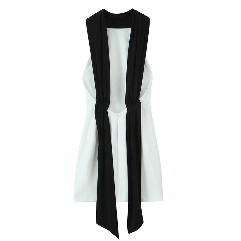 Slim-fitting black patchwork halter dress with asymmetric skirt and high waist detail