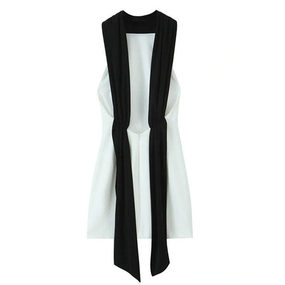 Slim-fitting black patchwork halter dress with asymmetric skirt and high waist detail