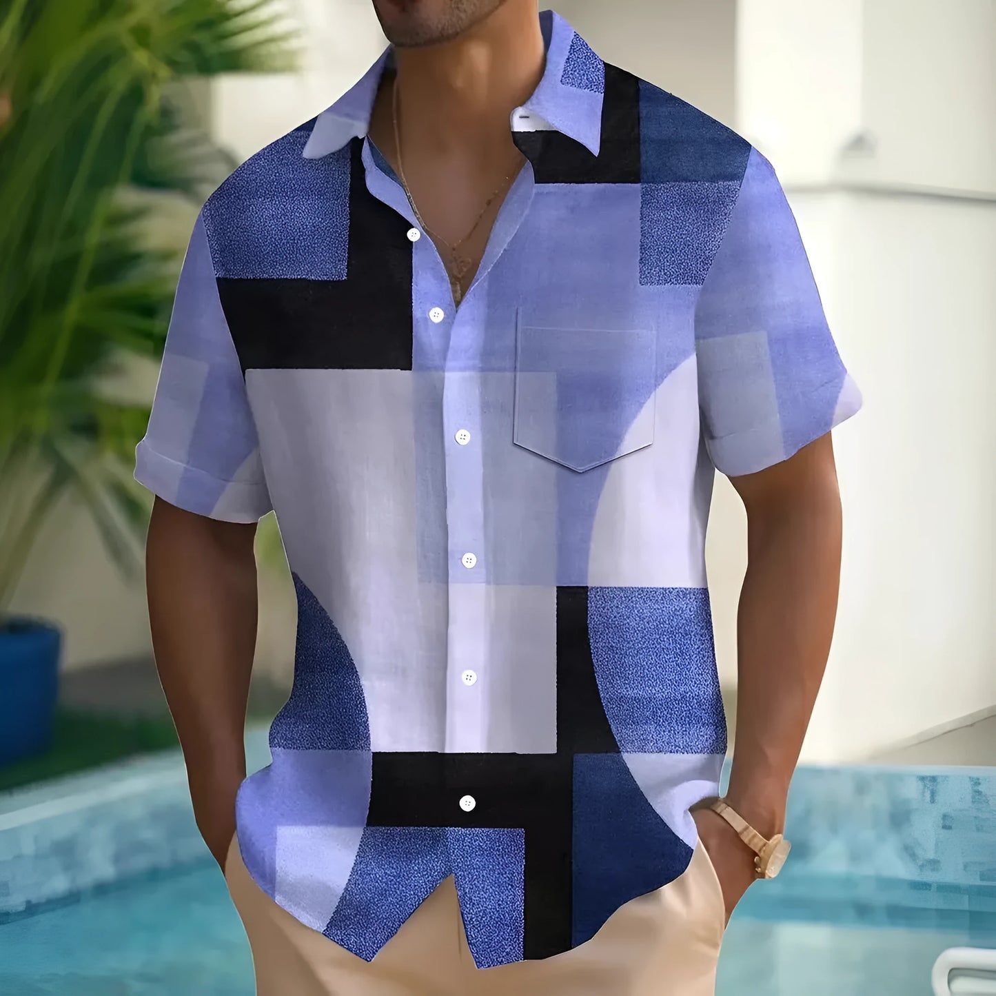 Man wearing a loose-fit short sleeve cardigan shirt with a retro geometric square pattern in contrasting colours.