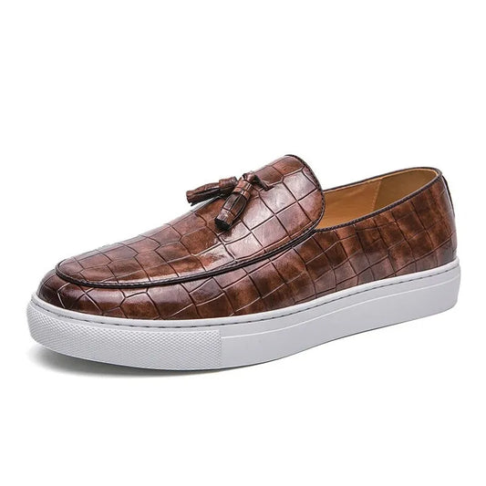 Men's black sneakers with tassel detailing, round toe, and rubber sole for business casual settings
