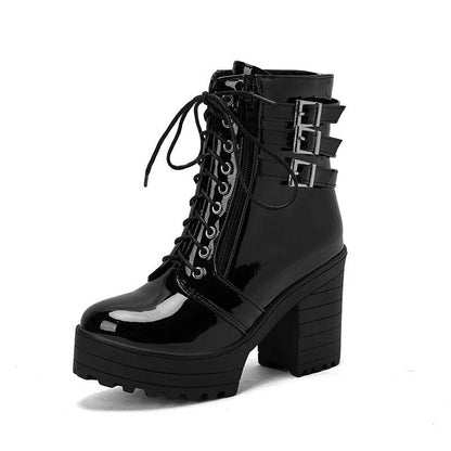 Women's black chunky heel ankle boots with round toe and front lace-up on a waterproof platform sole.