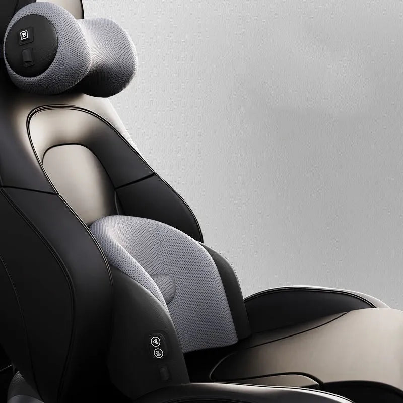 Black car massage cushion with adjustable straps attached to a car seat headrest