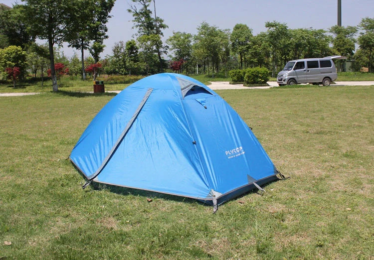 Double layer rainproof camping tent in green, orange, and blue colors for high altitude adventures