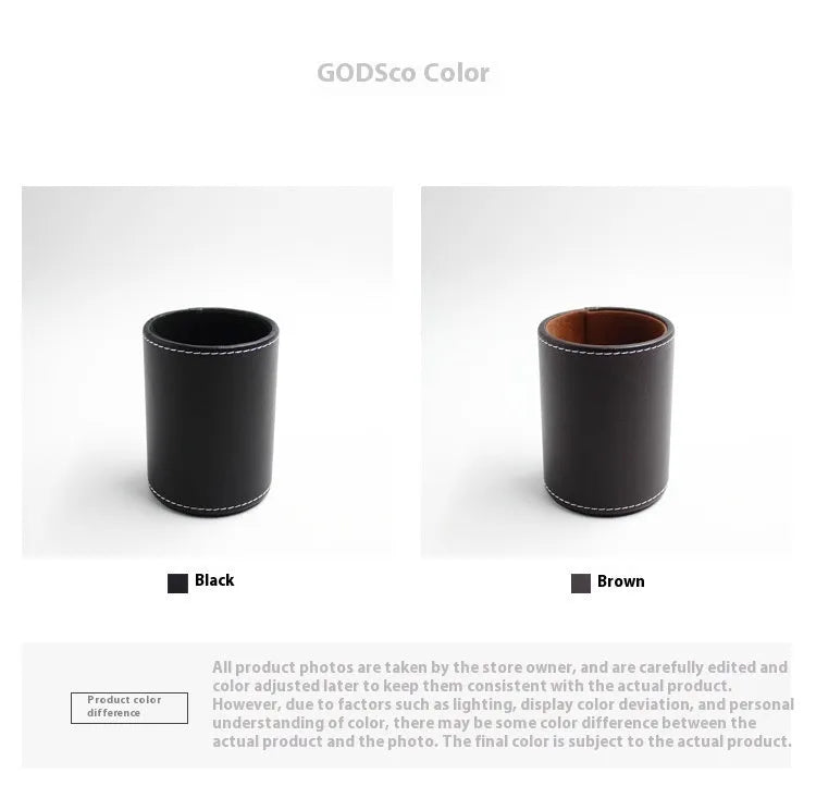 Round black leather pen container measuring 8.0cm diameter by 10.8cm height on wooden desk
