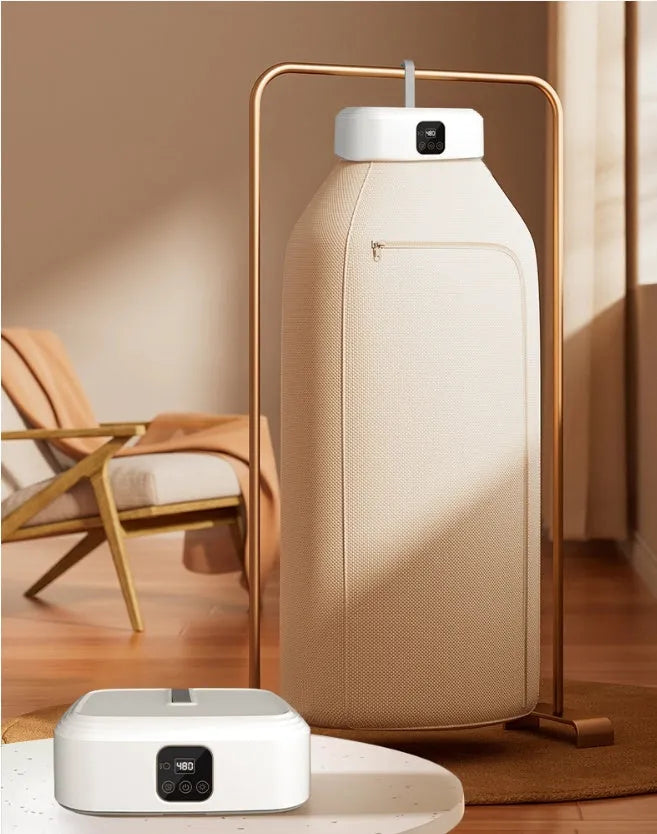 White cylindrical compact laundry dryer with remote control, dimensions 29x22x10cm, foldable for storage